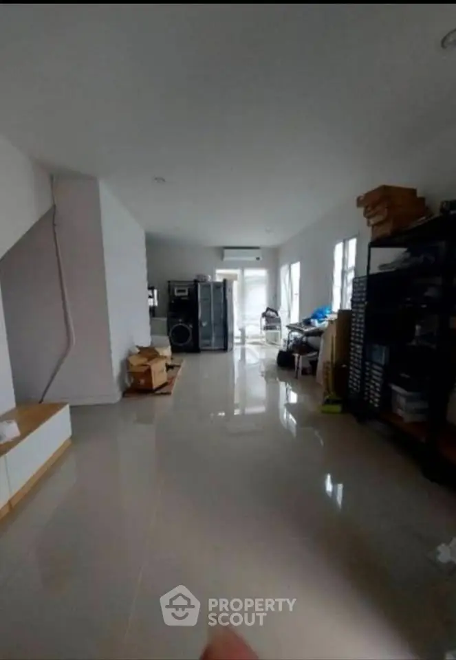 Spacious interior with glossy floors and ample natural light, ideal for versatile living arrangements.