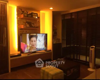 Cozy living room with ambient lighting and modern TV setup