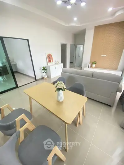 Modern living room with stylish furniture and open layout, perfect for family gatherings.