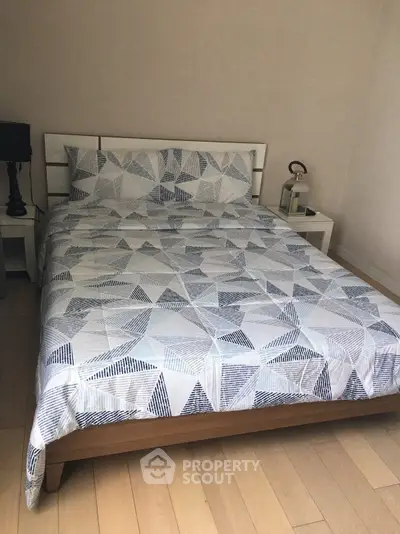 Cozy bedroom with modern geometric bedding and stylish decor