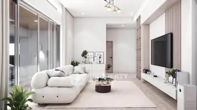 Modern living room with sleek design, large TV, and cozy white sofa in open layout.