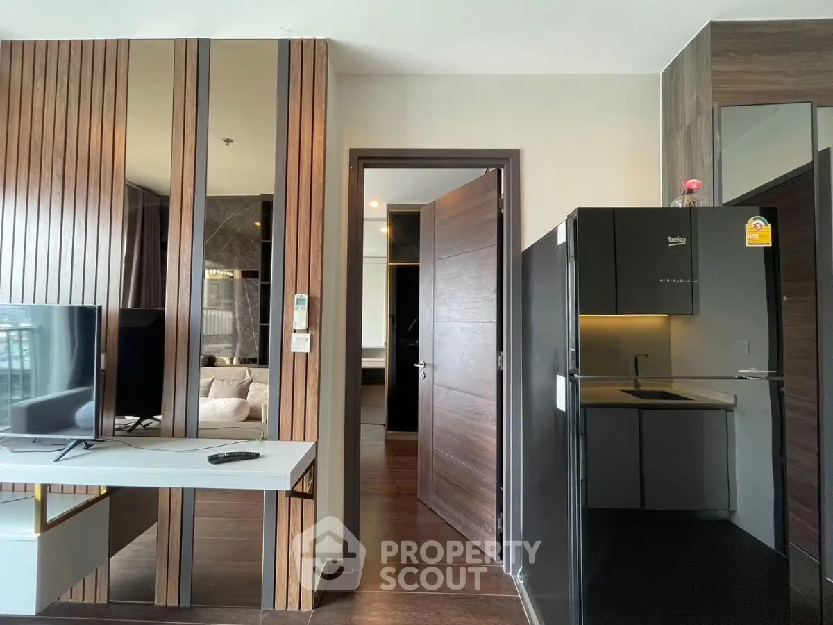 Modern apartment interior with sleek kitchen and stylish living area