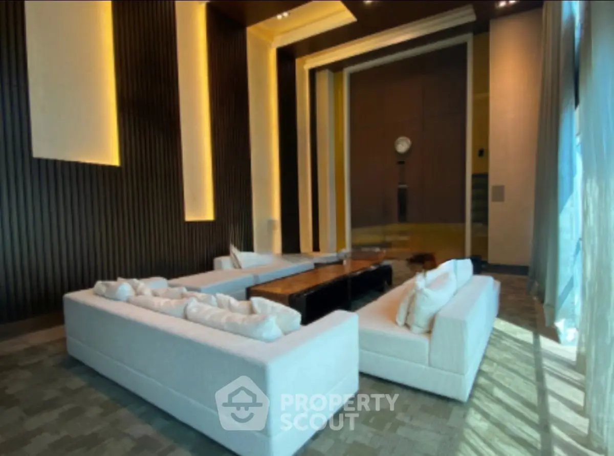 Luxurious modern living room with elegant lighting and plush white sofas