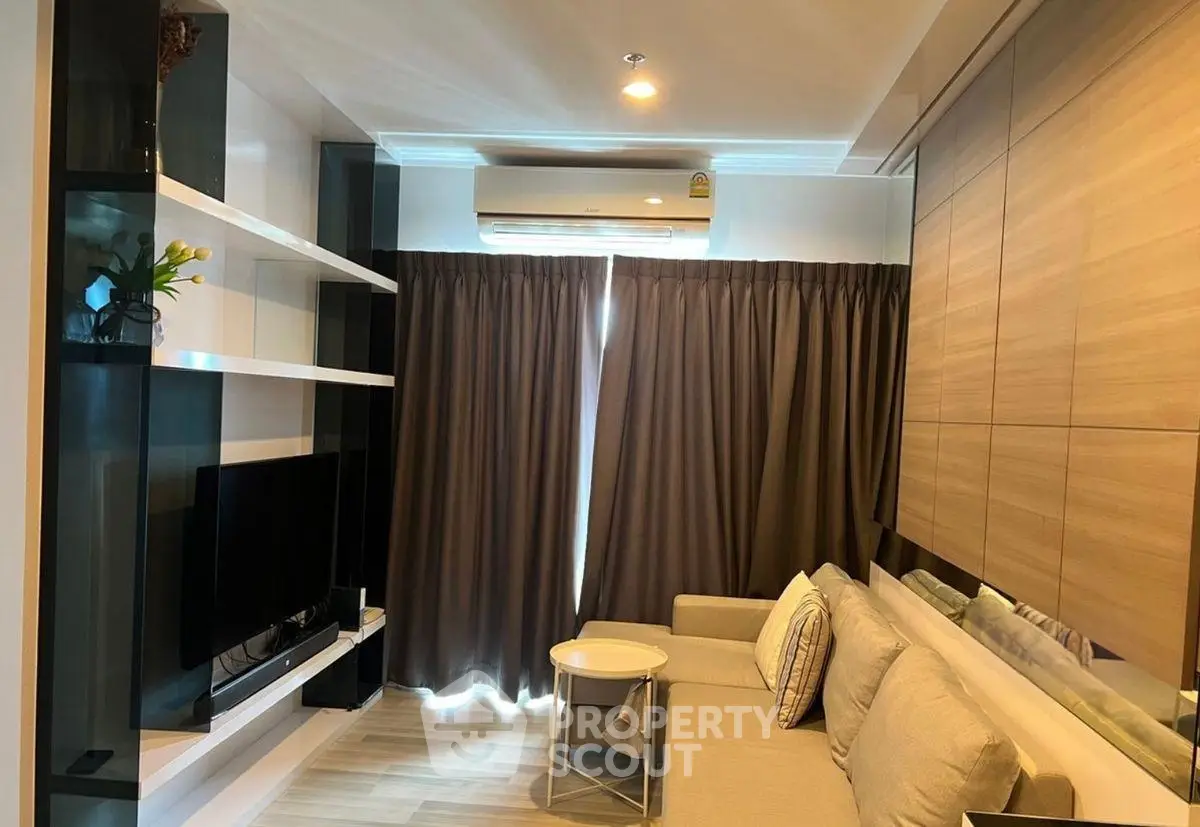 Modern living room with sleek design and cozy seating area