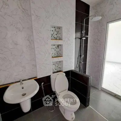 Modern bathroom with sleek fixtures and stylish tile design