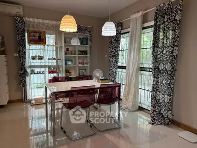 Chic dining area with modern decor and ample natural light, perfect for stylish gatherings.