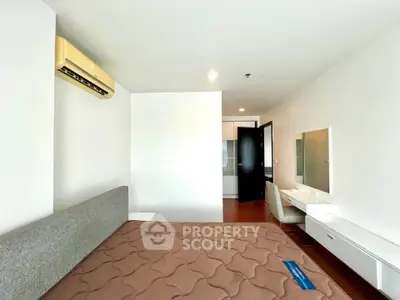 Modern bedroom with air conditioning and stylish furniture in a contemporary apartment.