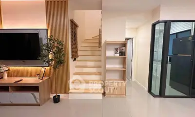 Modern interior with sleek staircase and stylish living area