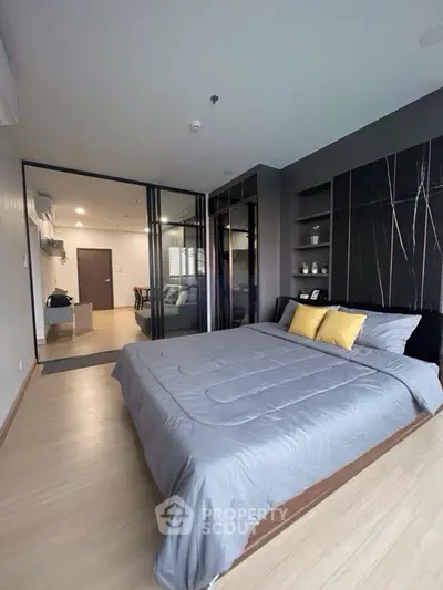 Modern bedroom with sleek design and open layout in a stylish apartment.