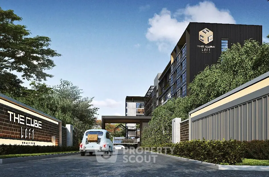 Modern apartment building with sleek design and lush greenery at The Cube Loft.