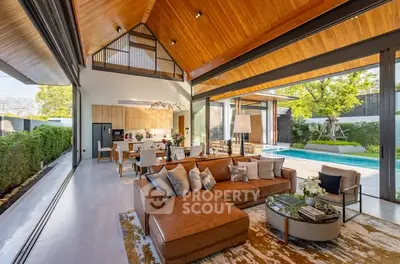 Luxurious open-plan living room with pool view and modern decor