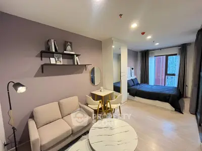 Modern studio apartment with cozy living area and stylish bedroom