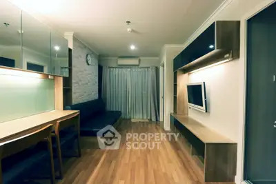 Modern living room with sleek wooden flooring and stylish furniture