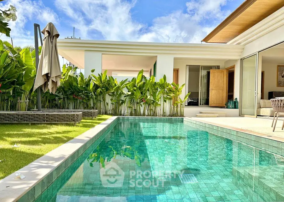 Luxurious modern villa with private pool and lush garden, perfect for relaxation and entertainment.
