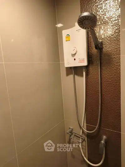 Modern bathroom with sleek shower unit and elegant tile design