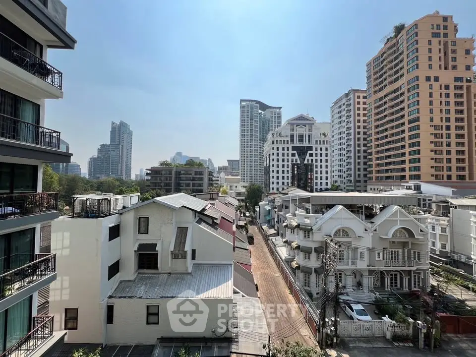 Stunning cityscape view showcasing modern high-rise buildings and charming residential architecture.