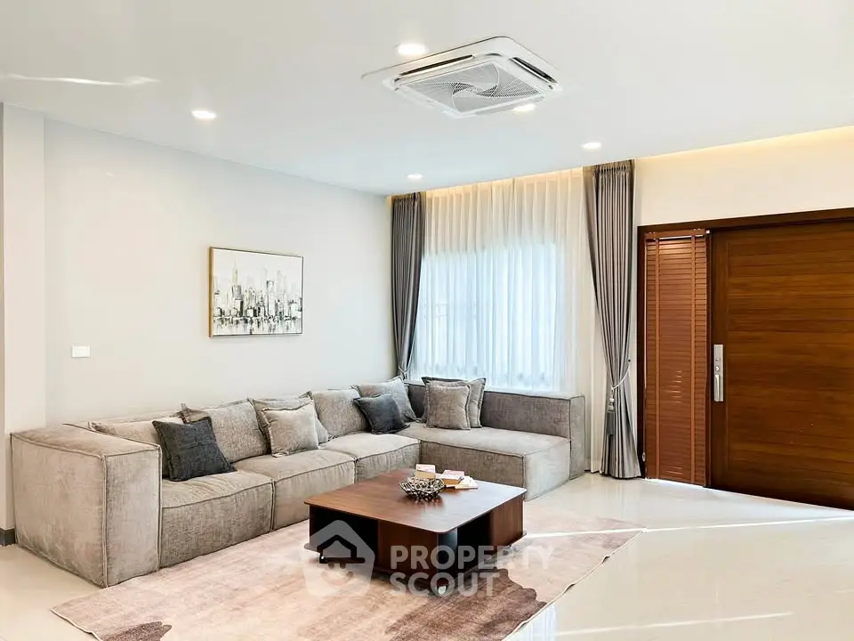 Spacious modern living room with elegant decor and large sectional sofa