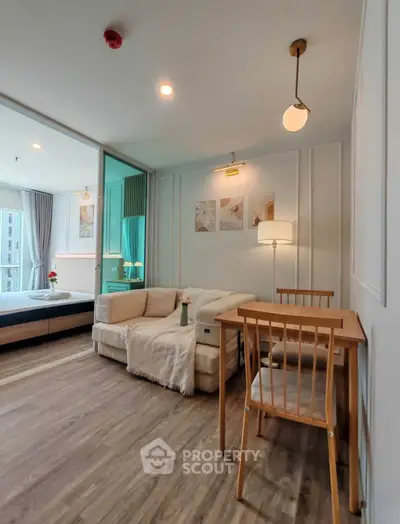 Modern living room with cozy seating and stylish decor in a bright apartment