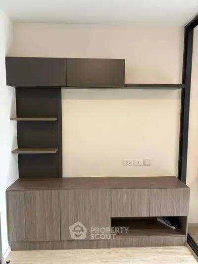 Modern built-in storage unit with sleek design and ample shelving in a contemporary living space.