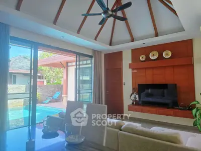 Luxurious living room with pool view and high ceiling, perfect for relaxation and entertainment.