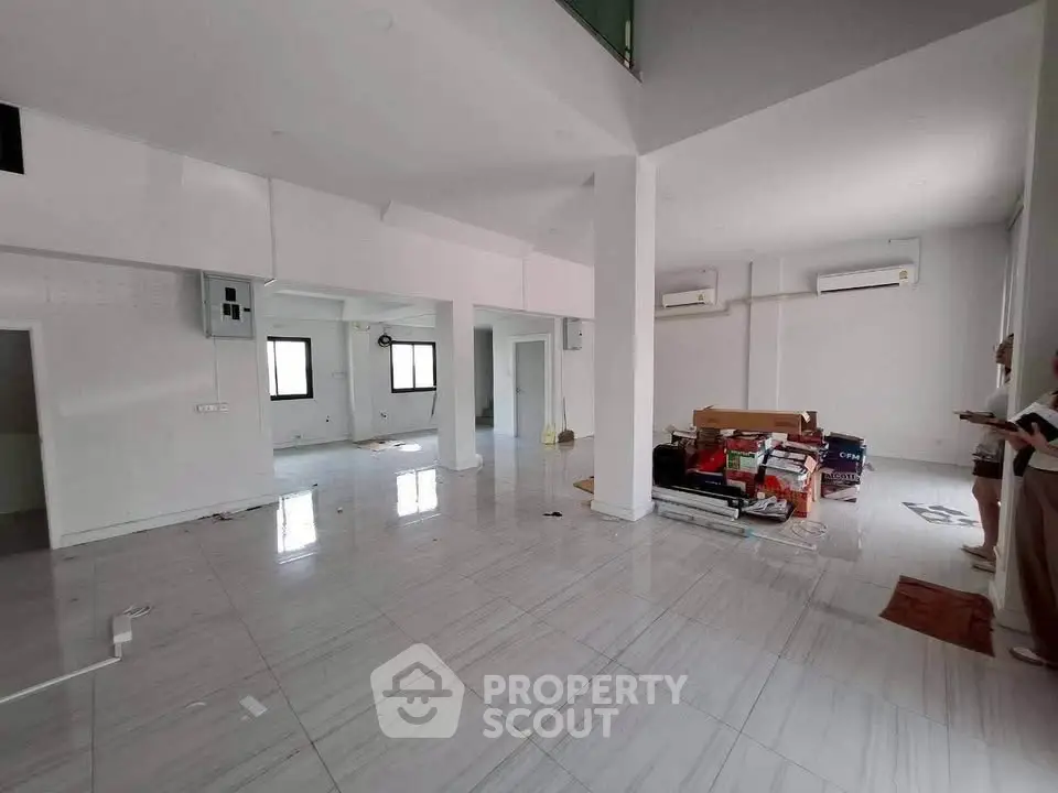 Spacious open-plan living area with modern finishes and ample natural light, ideal for contemporary living.