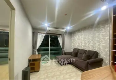 Modern living room with stylish wallpaper and comfortable seating.