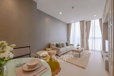 Elegant living room with cozy seating and natural light