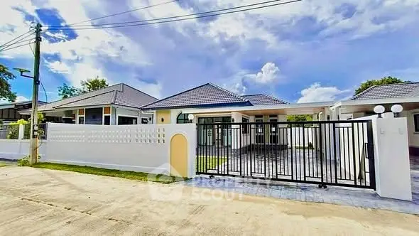 Charming single-story home with gated entrance and spacious driveway in a serene neighborhood.