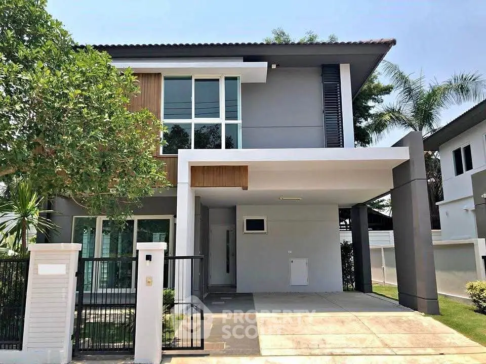 Modern two-story house with sleek design and spacious driveway