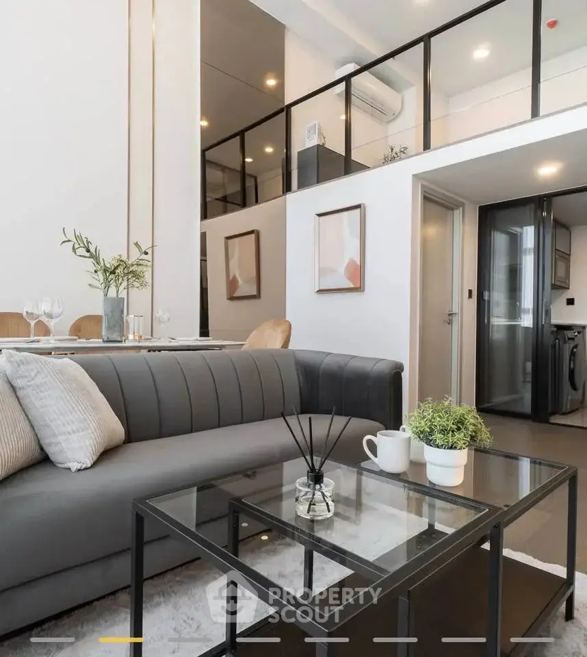 Modern loft apartment with stylish living room and open kitchen layout