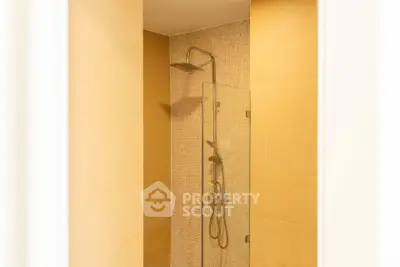 Modern bathroom with sleek shower design and elegant tile work.