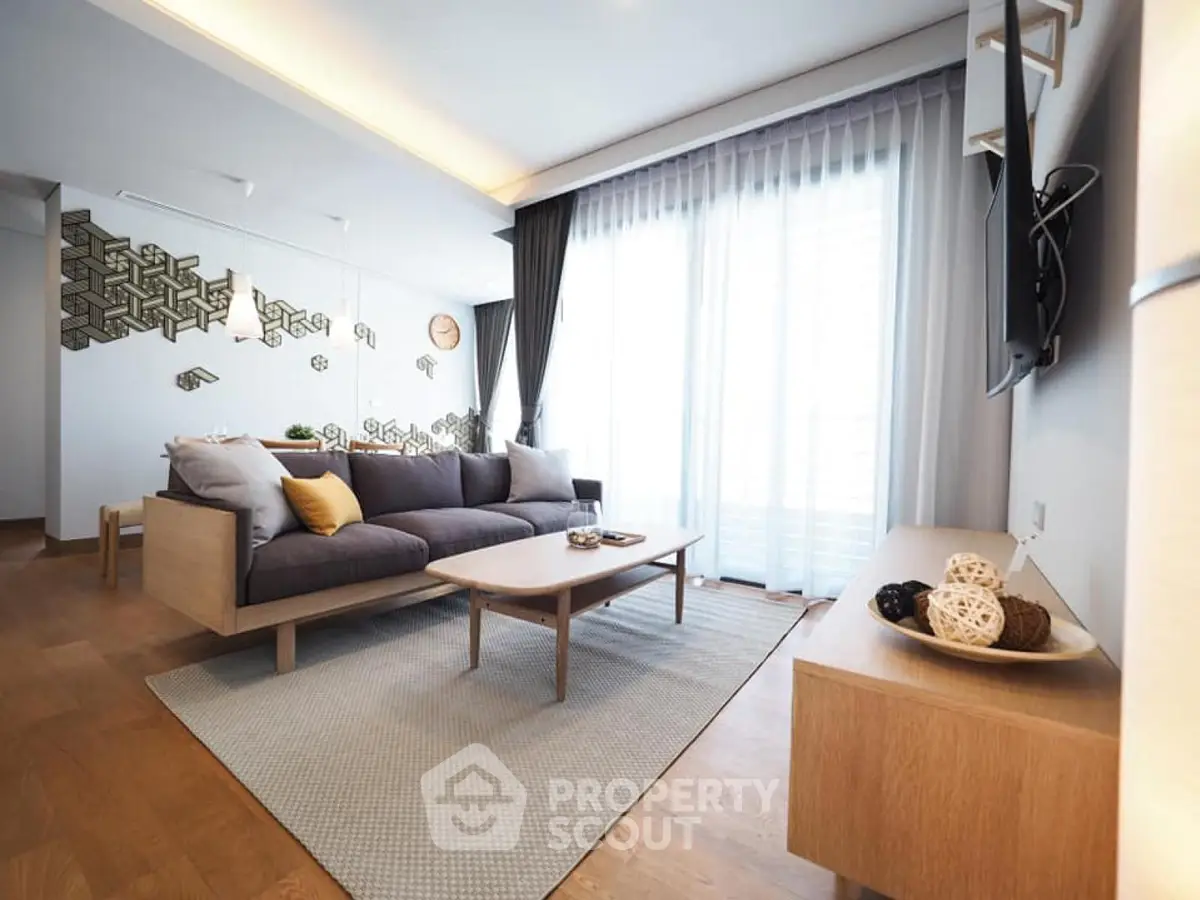 Spacious modern living room with stylish decor and natural light