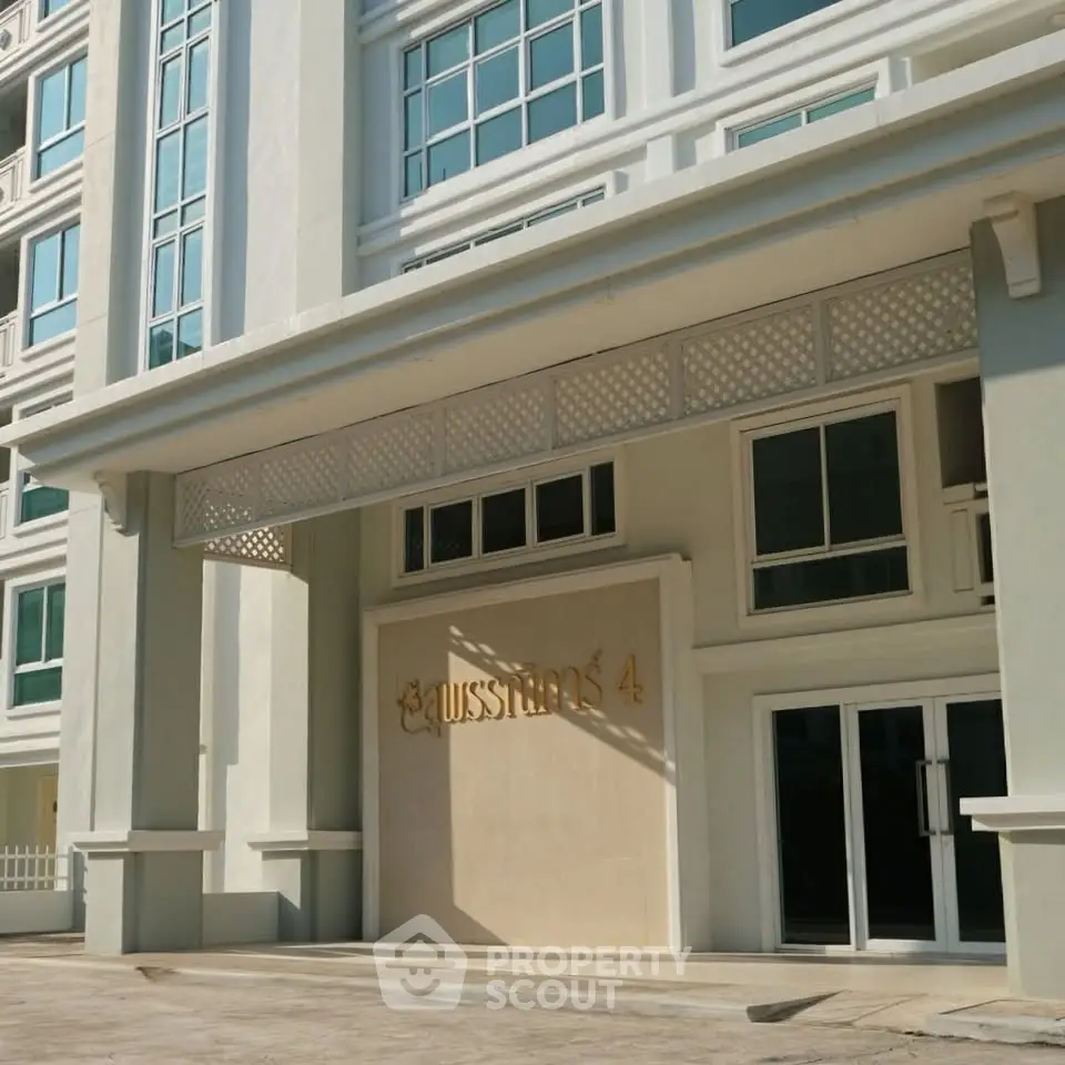 Elegant building entrance with modern architectural design and large glass windows