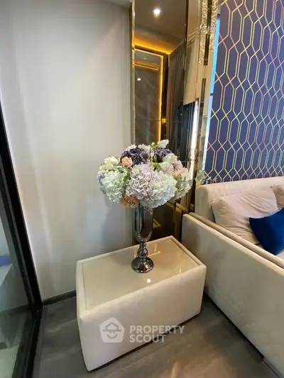 Elegant living room corner with floral arrangement and modern decor