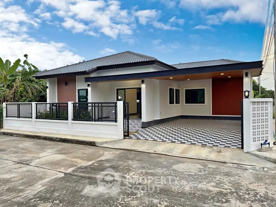 Modern single-story house with spacious driveway and stylish exterior design