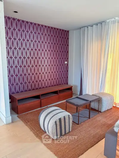 Stylish living room with modern furniture and vibrant accent wall