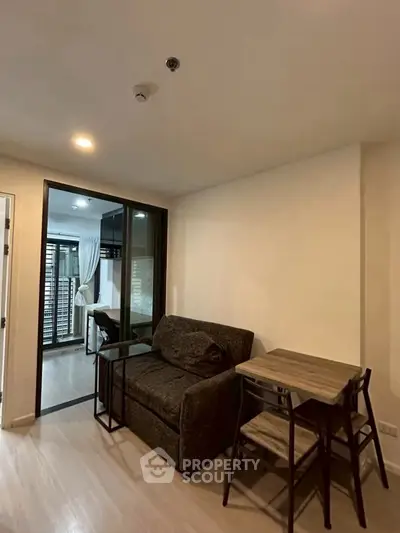 Cozy modern living room with compact dining area and stylish decor