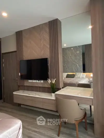 Modern living room with sleek TV setup and elegant furniture design