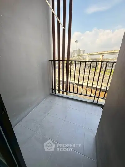 Modern balcony with city view and sleek railing design