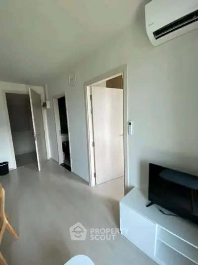 Modern apartment interior with air conditioning and TV setup