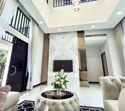 Luxurious modern living room with high ceilings and elegant decor