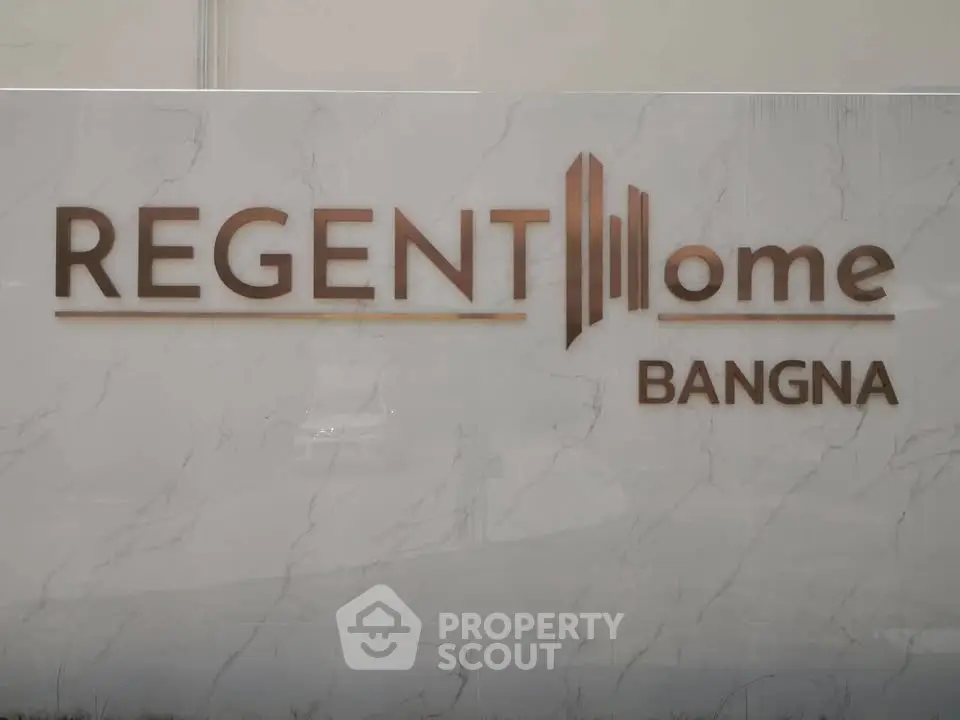 Regent Home Bangna marble sign showcasing luxury real estate development.