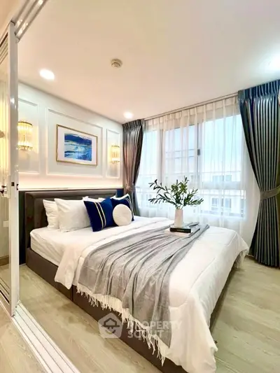 Elegant bedroom with modern decor and large windows for natural light