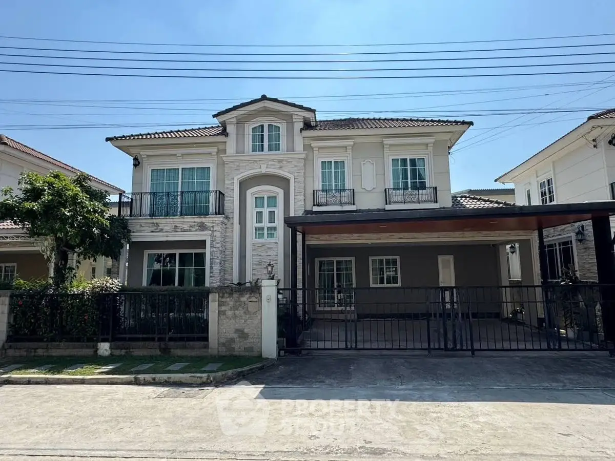 Elegant two-story house with modern facade and spacious driveway in a serene neighborhood.