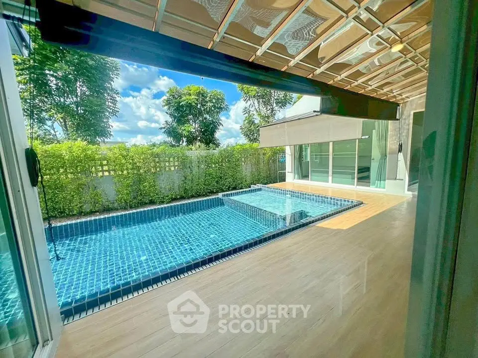 Luxurious private pool with serene garden view in modern home