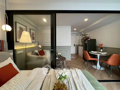 Modern studio apartment with cozy living area and stylish kitchen