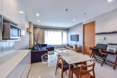 Modern living room with sleek furniture and natural light, perfect for relaxation and entertainment.