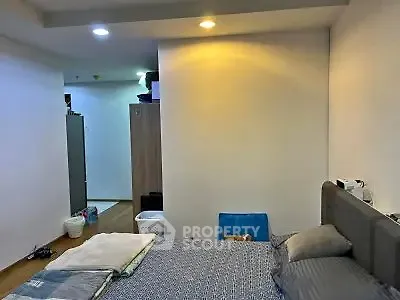 Cozy bedroom with modern lighting and stylish decor