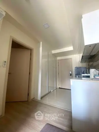 Modern kitchen with sleek cabinetry and ample natural light