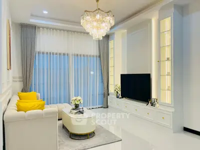 Luxurious living room with elegant chandelier and modern decor